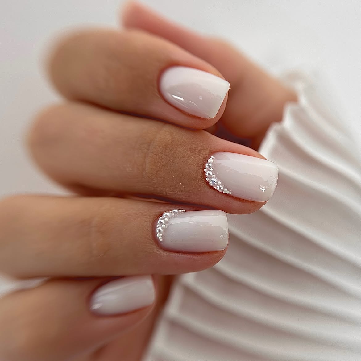 Milky White Short Nails with Pearl Accent