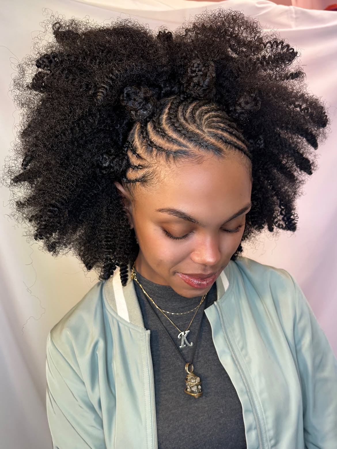 Natural Curls With Intricate Side Cornrow Braids