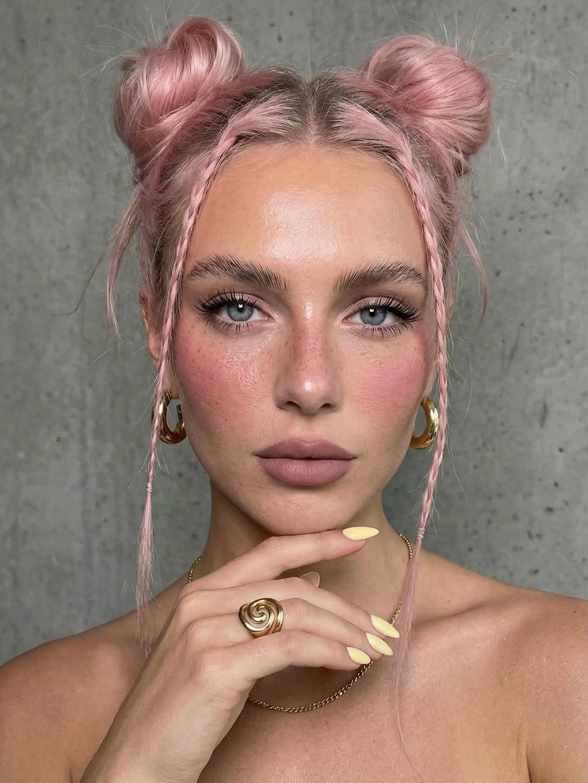 Pink Space Buns With Braided Face-Framing Strands