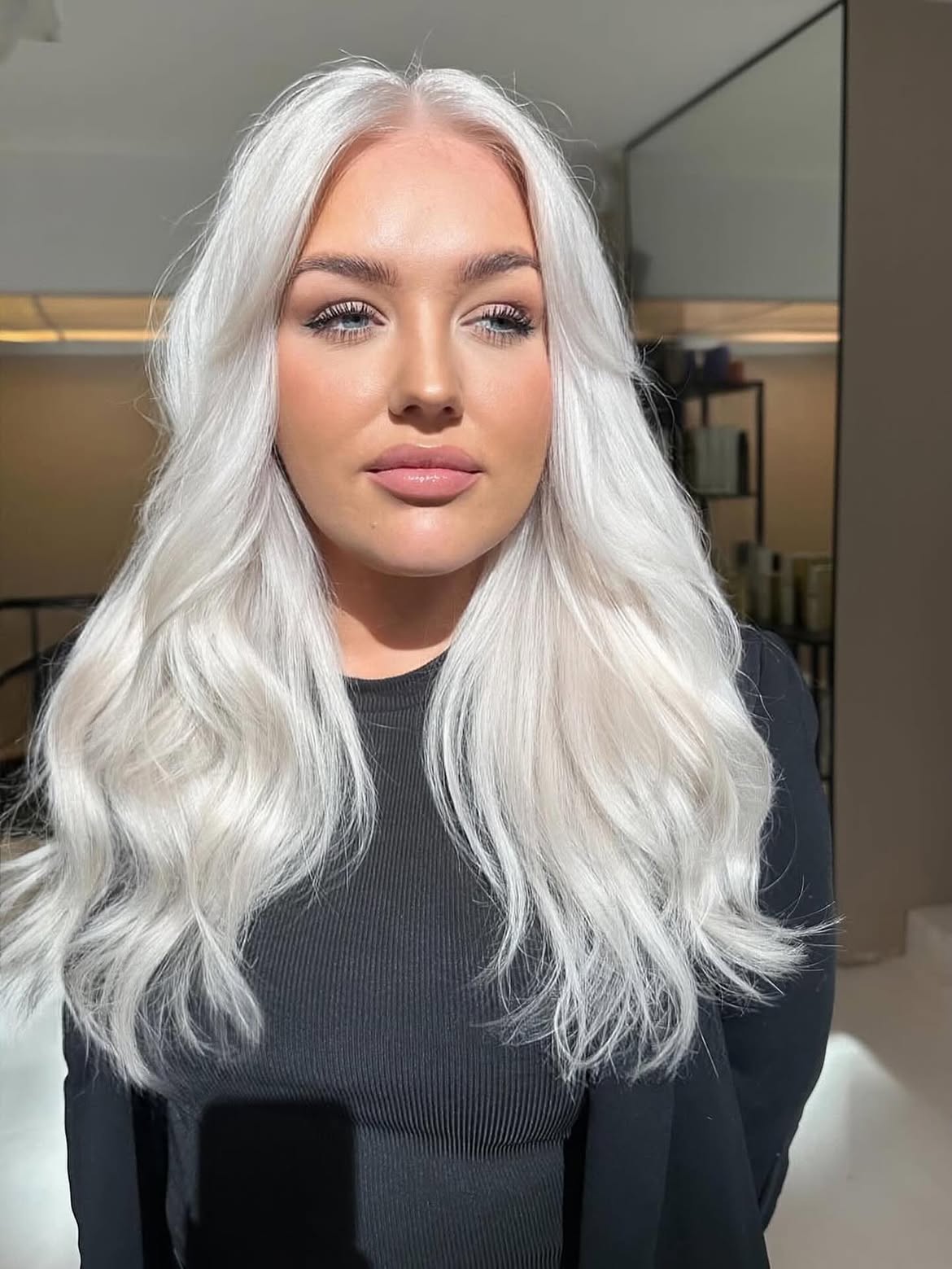Platinum Blonde Waves With Face-Framing Layers