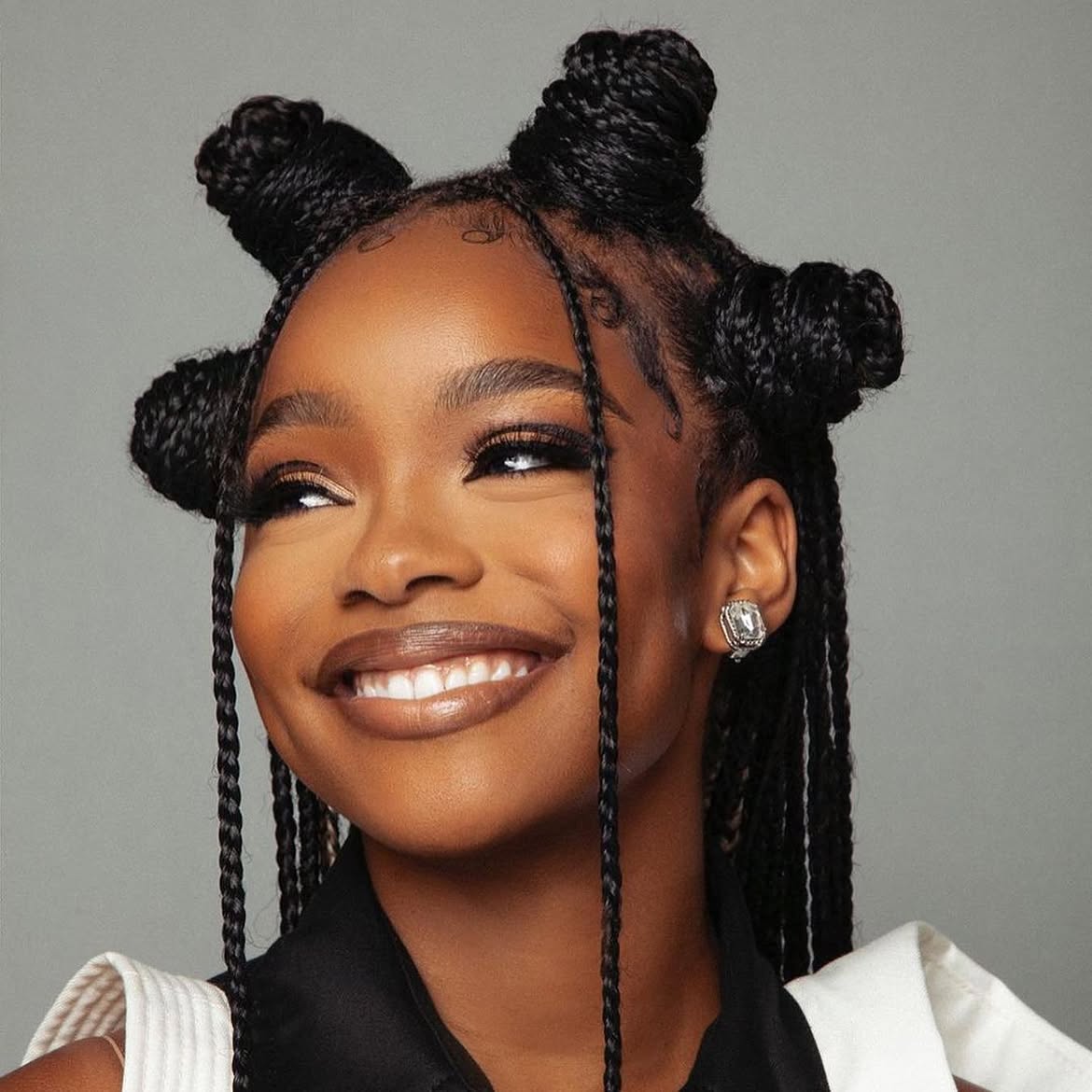 Playful Braided Bantu Knots With Loose Tendrils