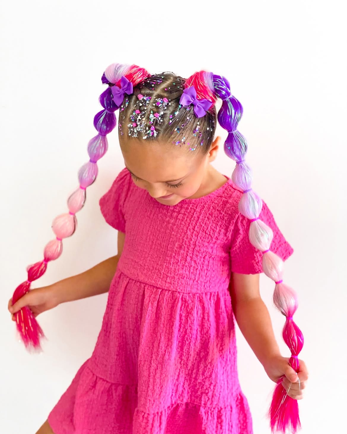 Playful Bubble Braids With Vibrant Extensions And Glitter