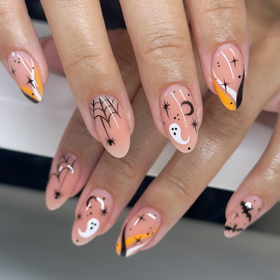 Playful Halloween Ghost and Spiderweb Almond Nails
