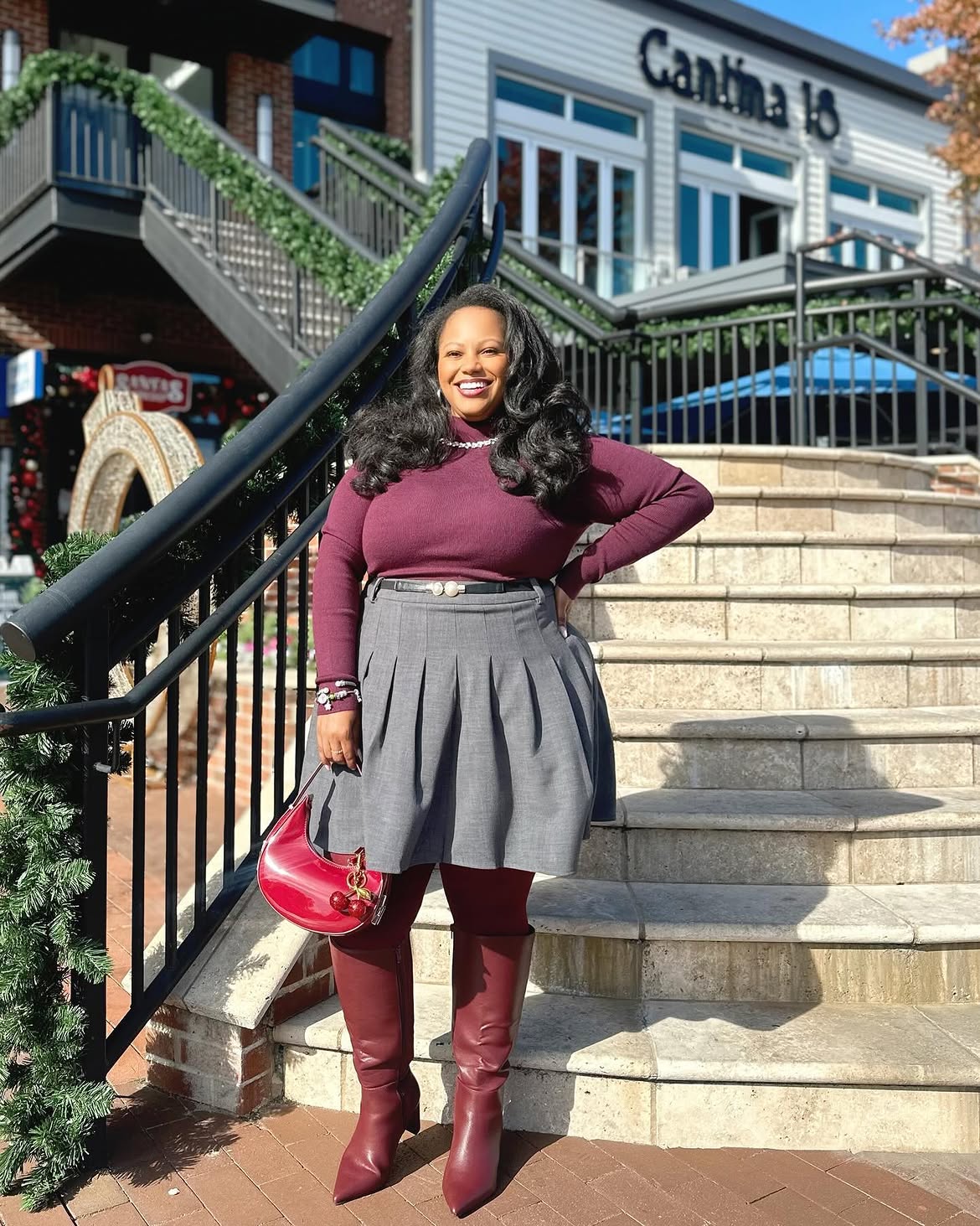 Plum Turtleneck With Pleated Skirt And Knee-High Boots
