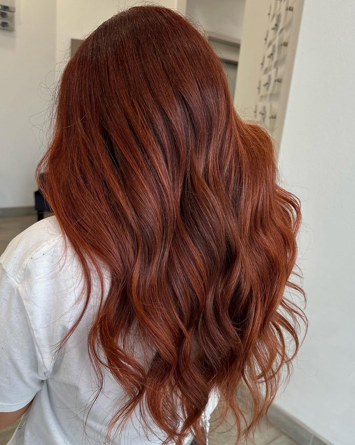 Rich Copper Tones On Long Layered Waves