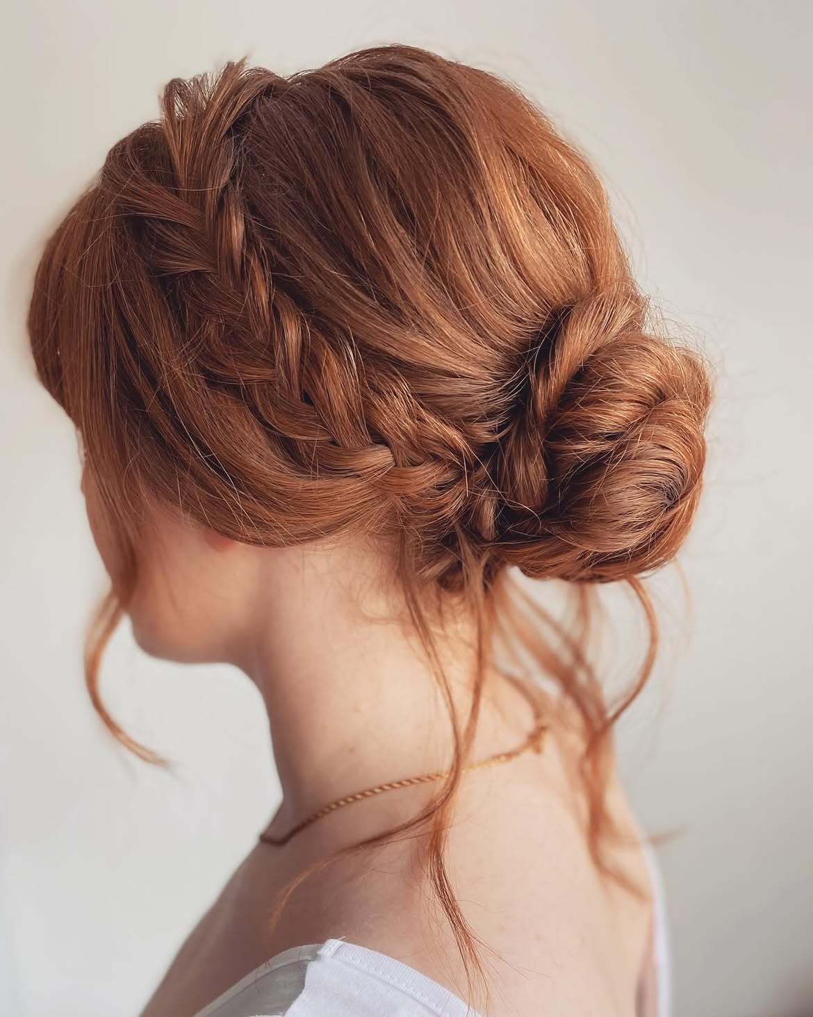 Romantic Braided Updo With Loose Tendrils