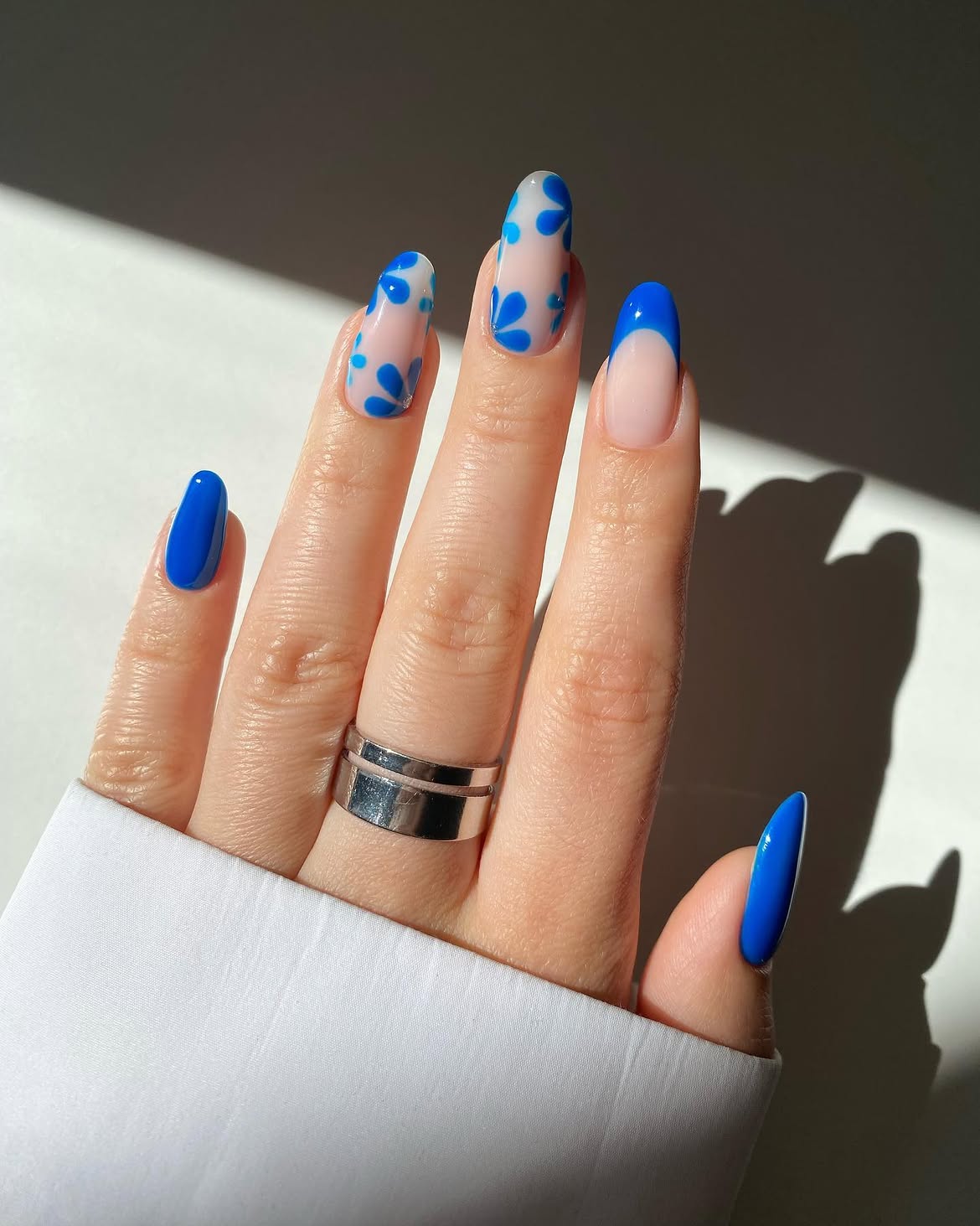 Royal Blue Floral Accent Almond Nails