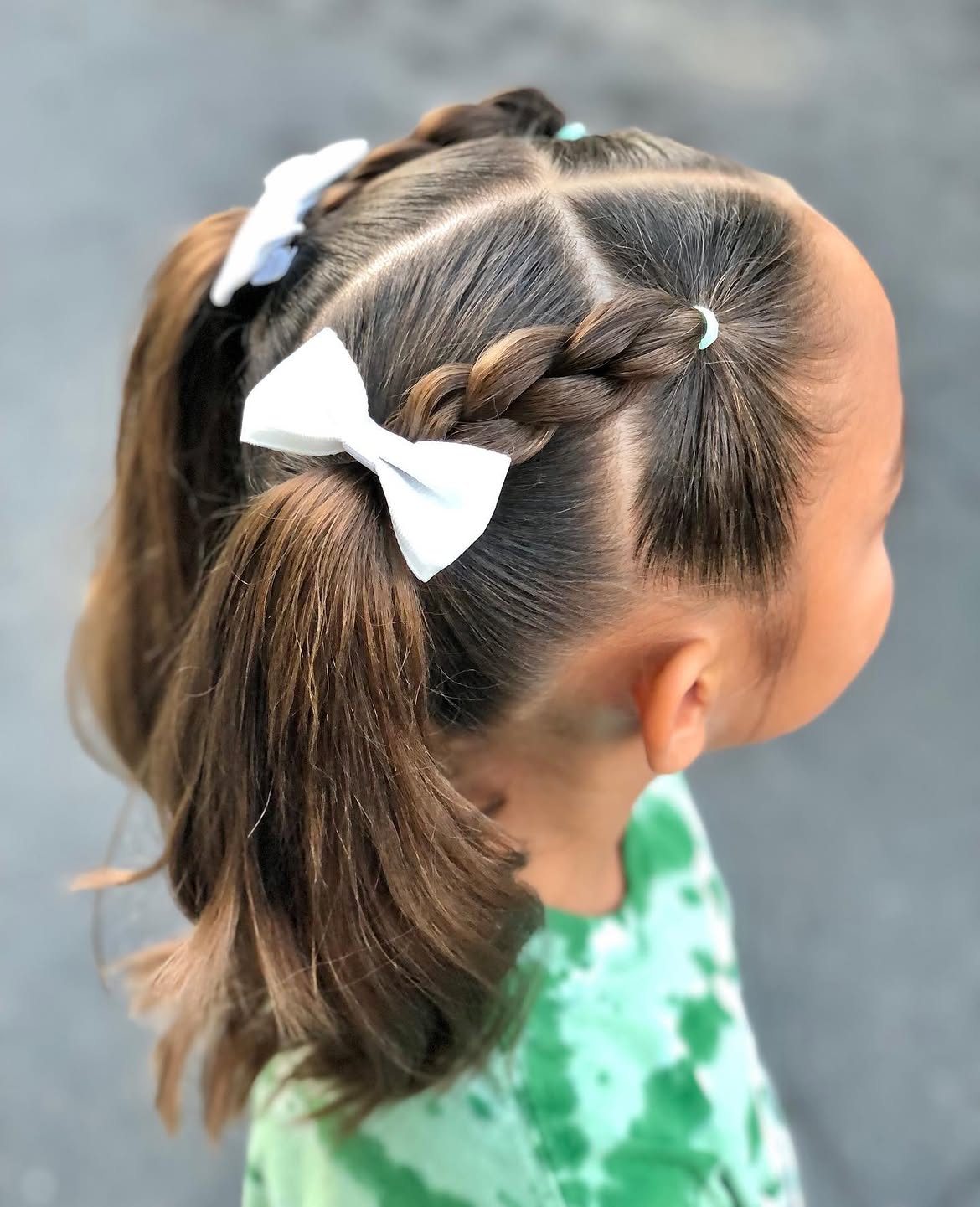 Sectioned Dutch Braids With White Bow Ponytails
