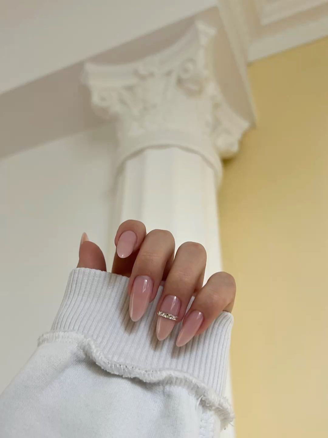 Sheer Pink Almond Nails with Rhinestone Accent