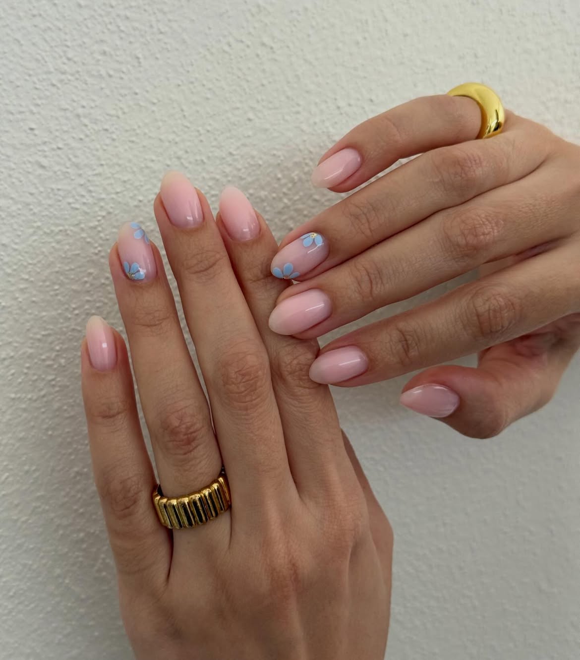 Sheer Pink Almond Nails with Tiny Blue Flowers