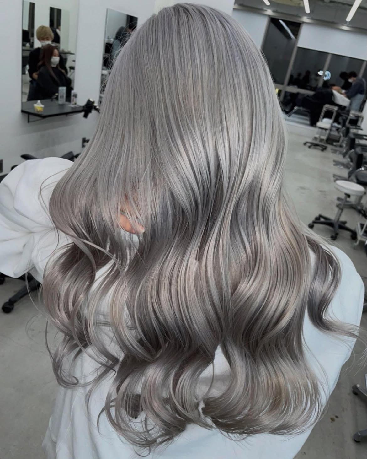 Shimmering Ash Blonde Waves With Subtle Dimension