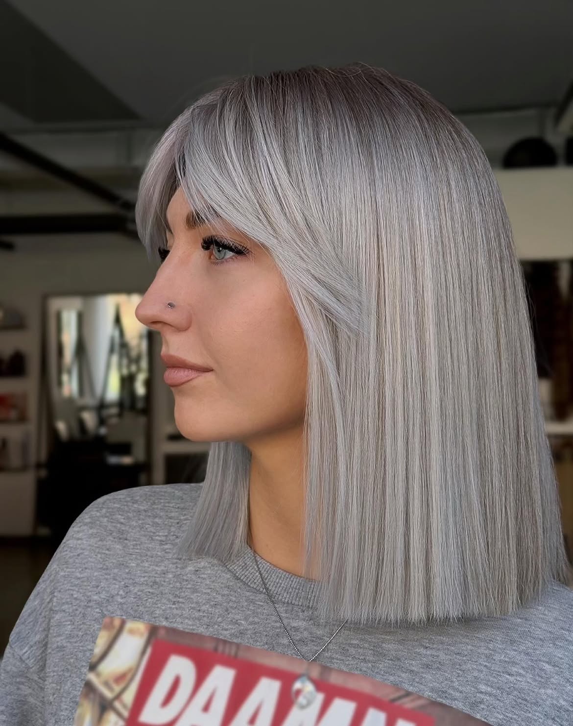 Sleek Ash Blonde Bob With Face-Framing Bangs