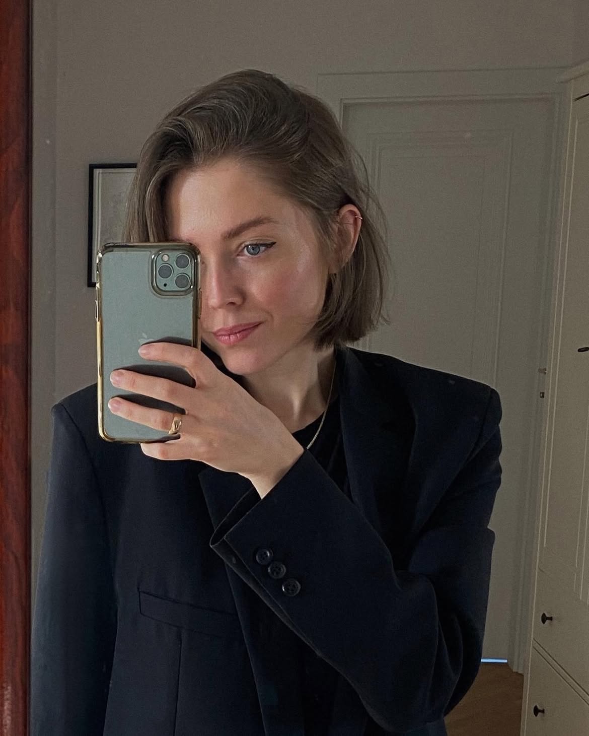 Sleek Black Blazer And Minimalist Jewelry