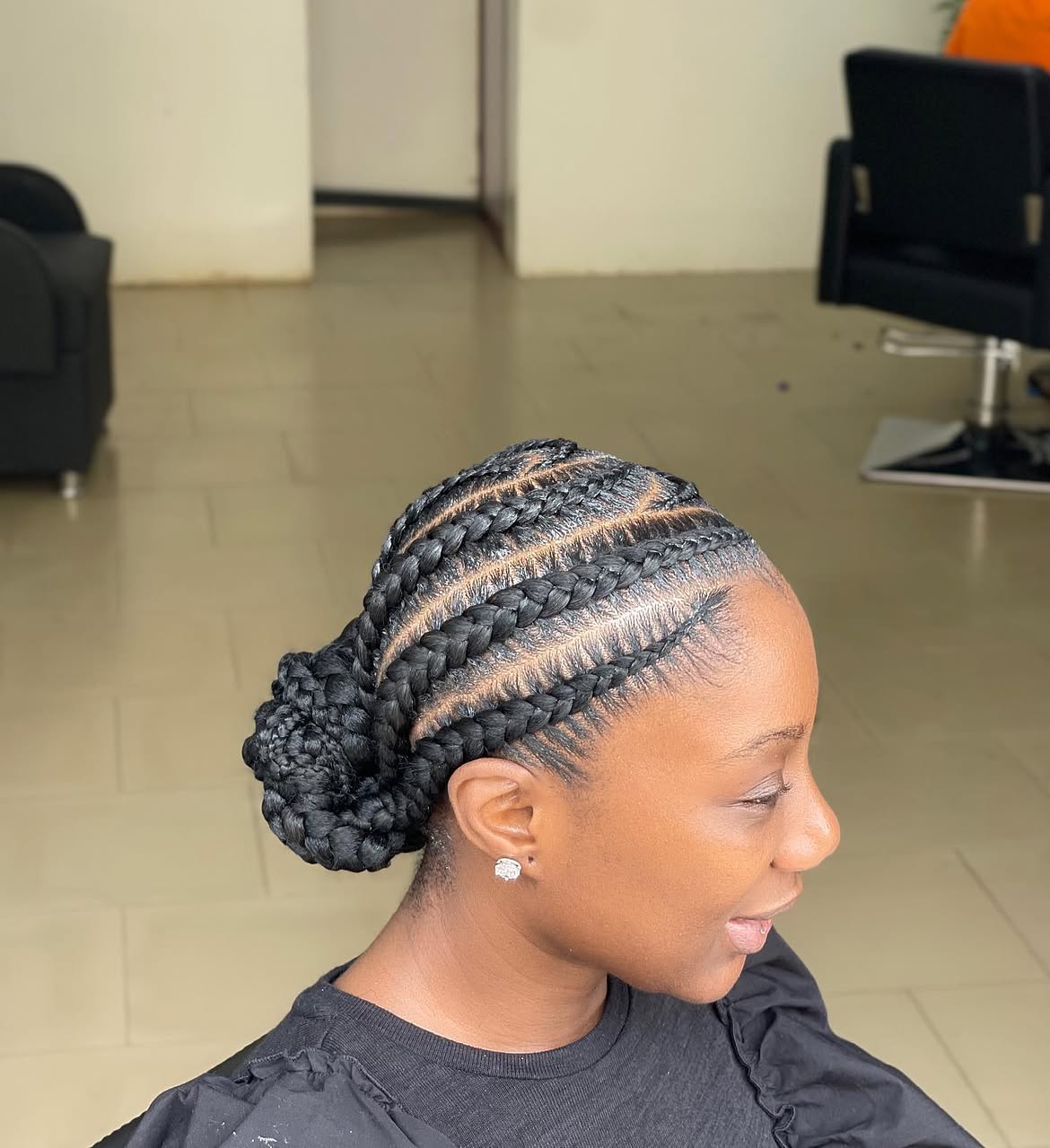 Sleek Cornrow Braids Into A Low Bun