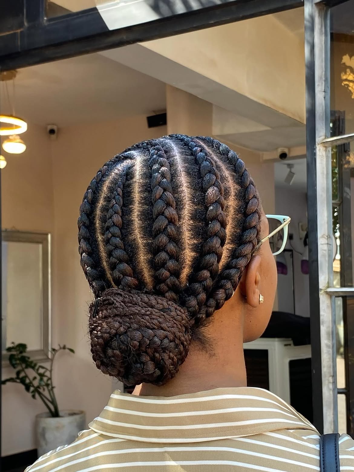 Sleek Cornrow Braids Into A Low Bun