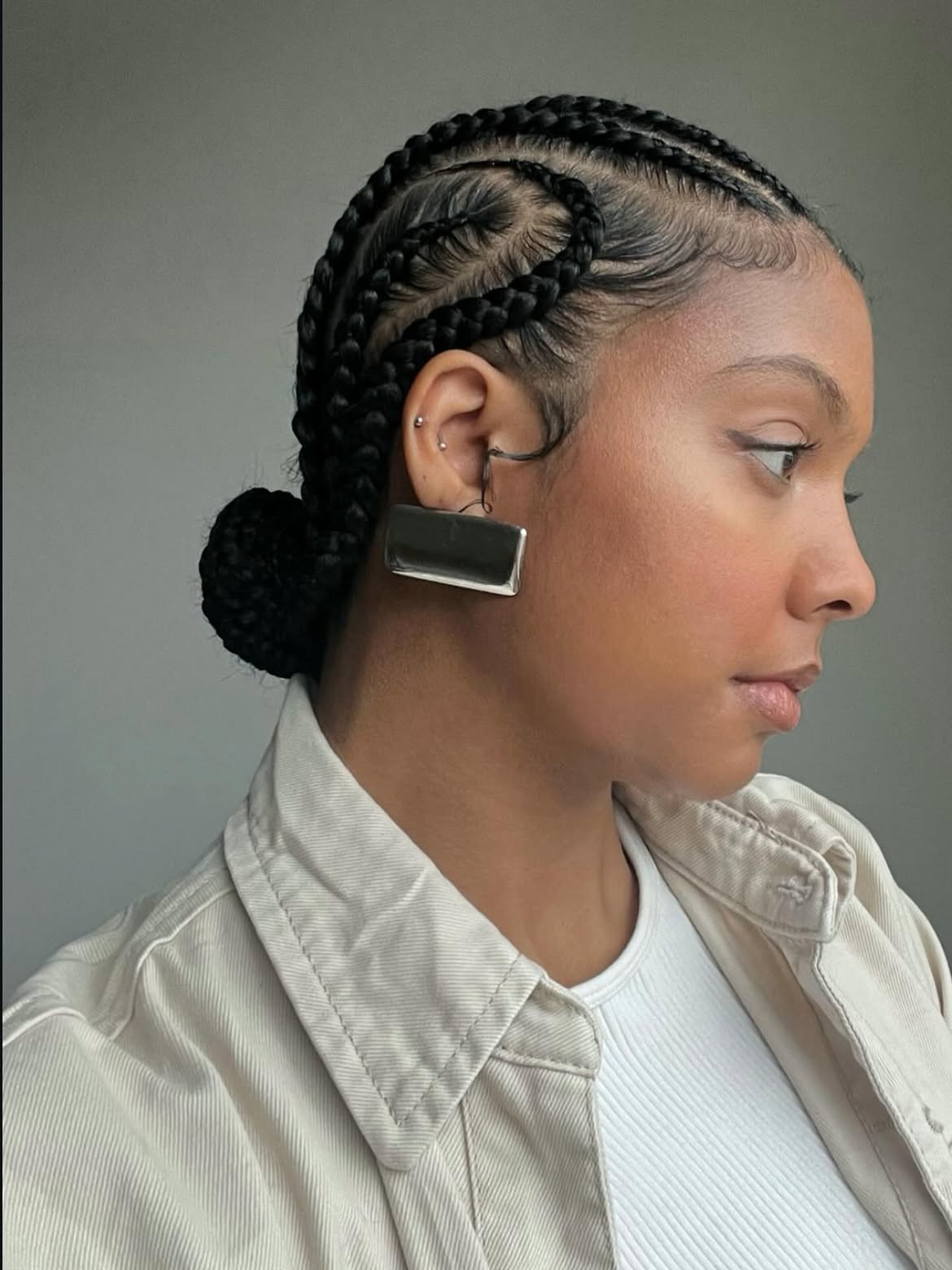 Sleek Cornrow Braids Into A Low Bun