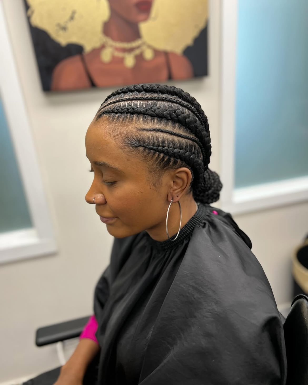 Sleek Cornrow Braids Into A Low Chignon