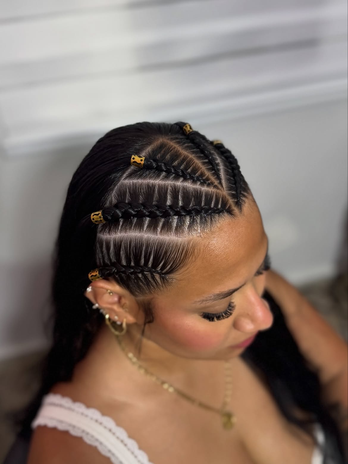 Sleek Cornrow Braids With Gold Accent Beads
