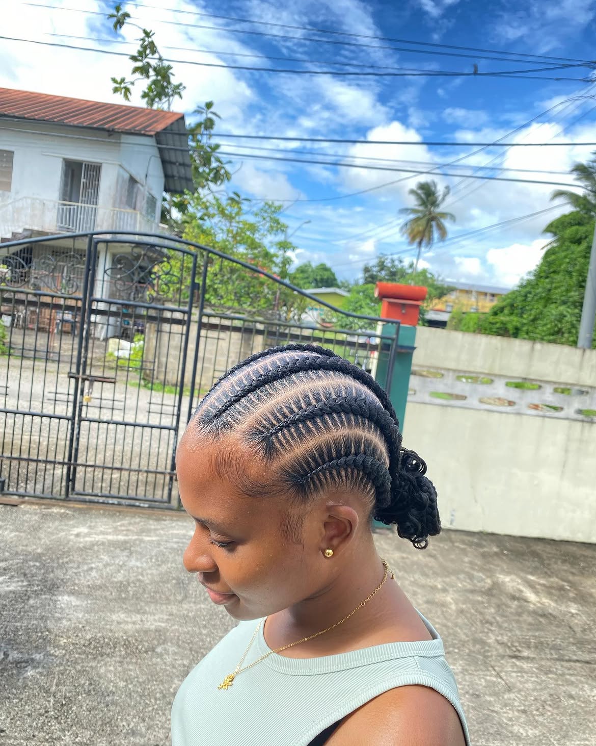 Sleek Feed In Cornrows With Low Braided Bun