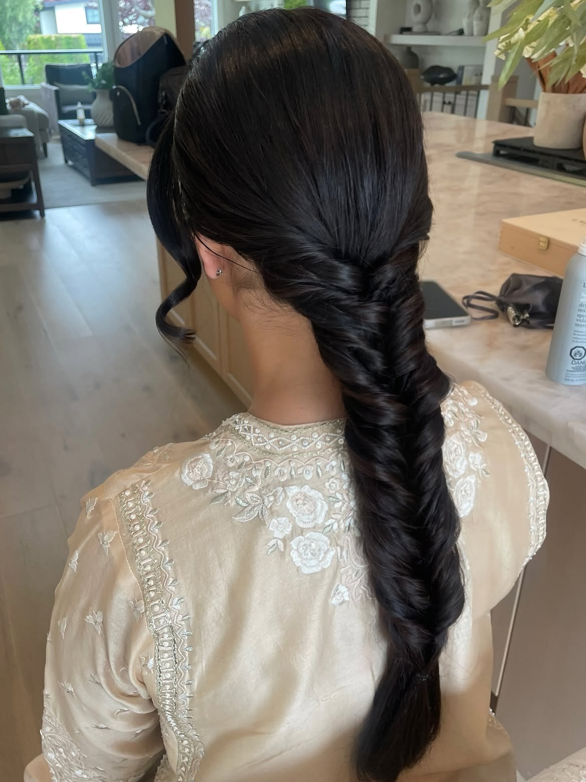 Sleek Fishtail Braid With Face-Framing Tendrils