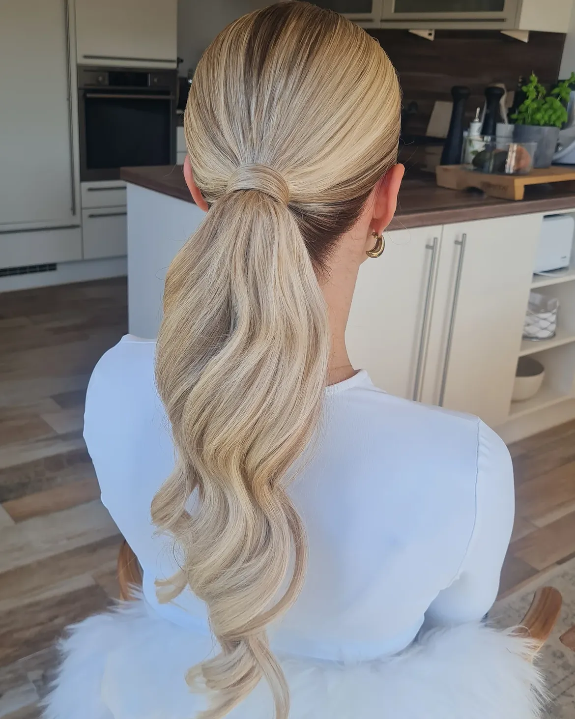 Sleek High Ponytail With Glamorous Waves
