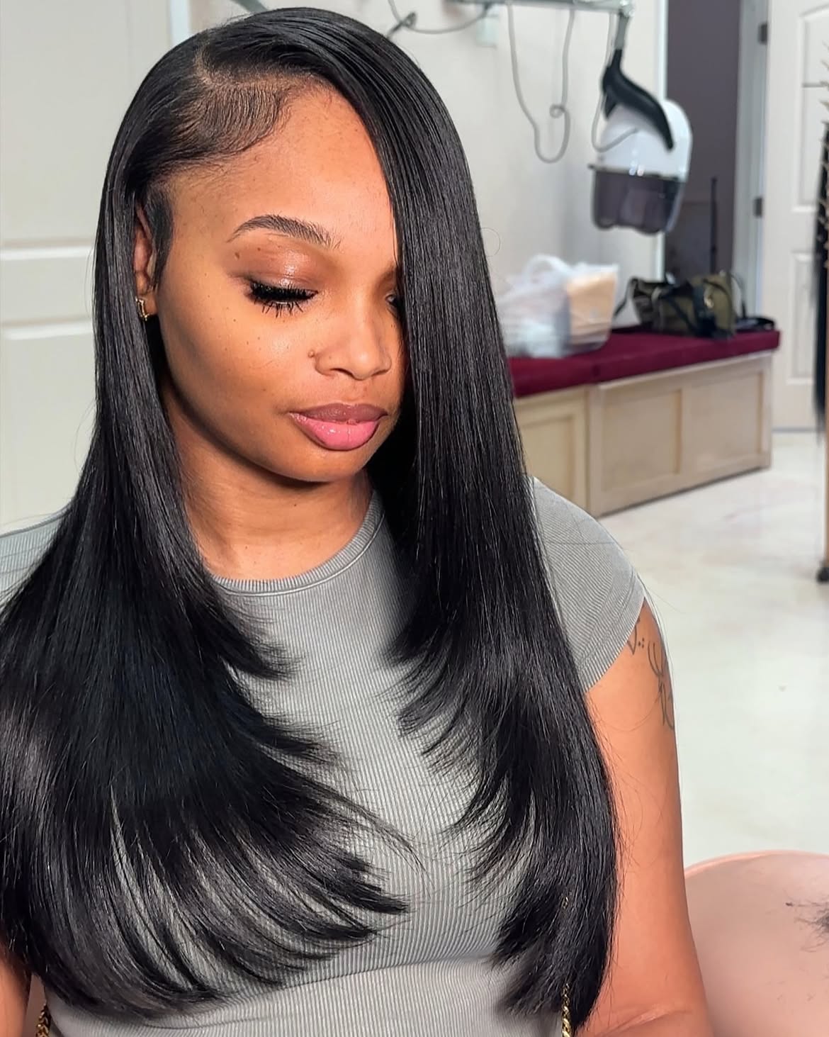 Sleek Layered Black Hair With Deep Side Part