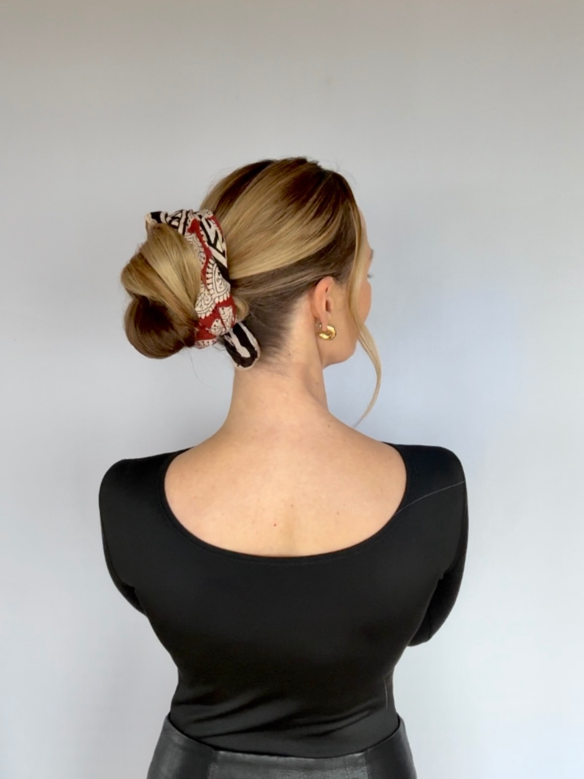 Sleek Low Bun With Patterned Silk Scarf
