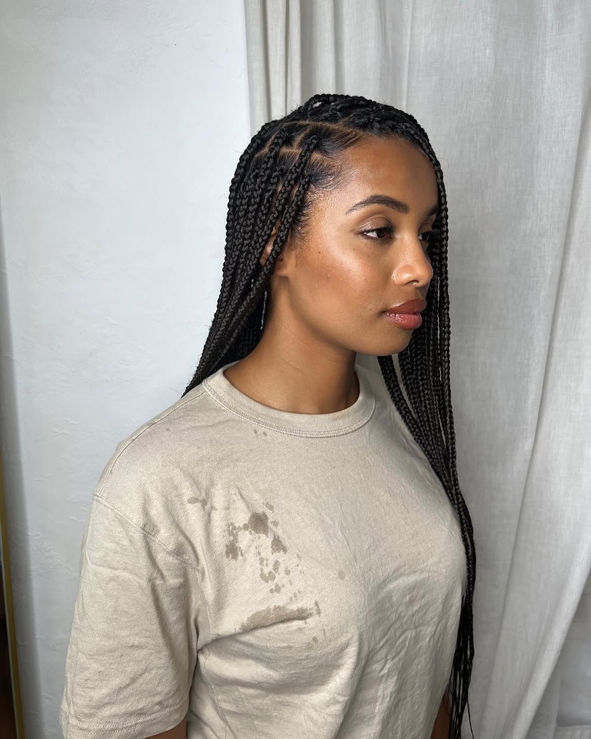 Sleek Medium Knotless Braids With Defined Parts