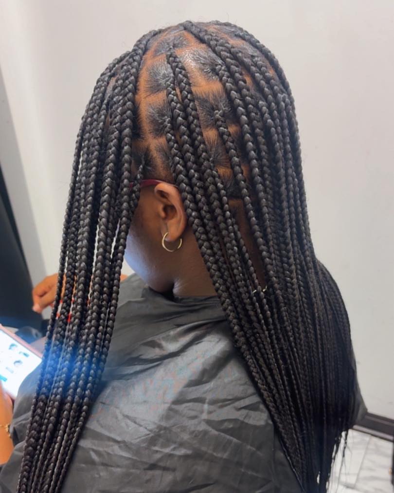 Sleek Medium Knotless Braids With Defined Parts