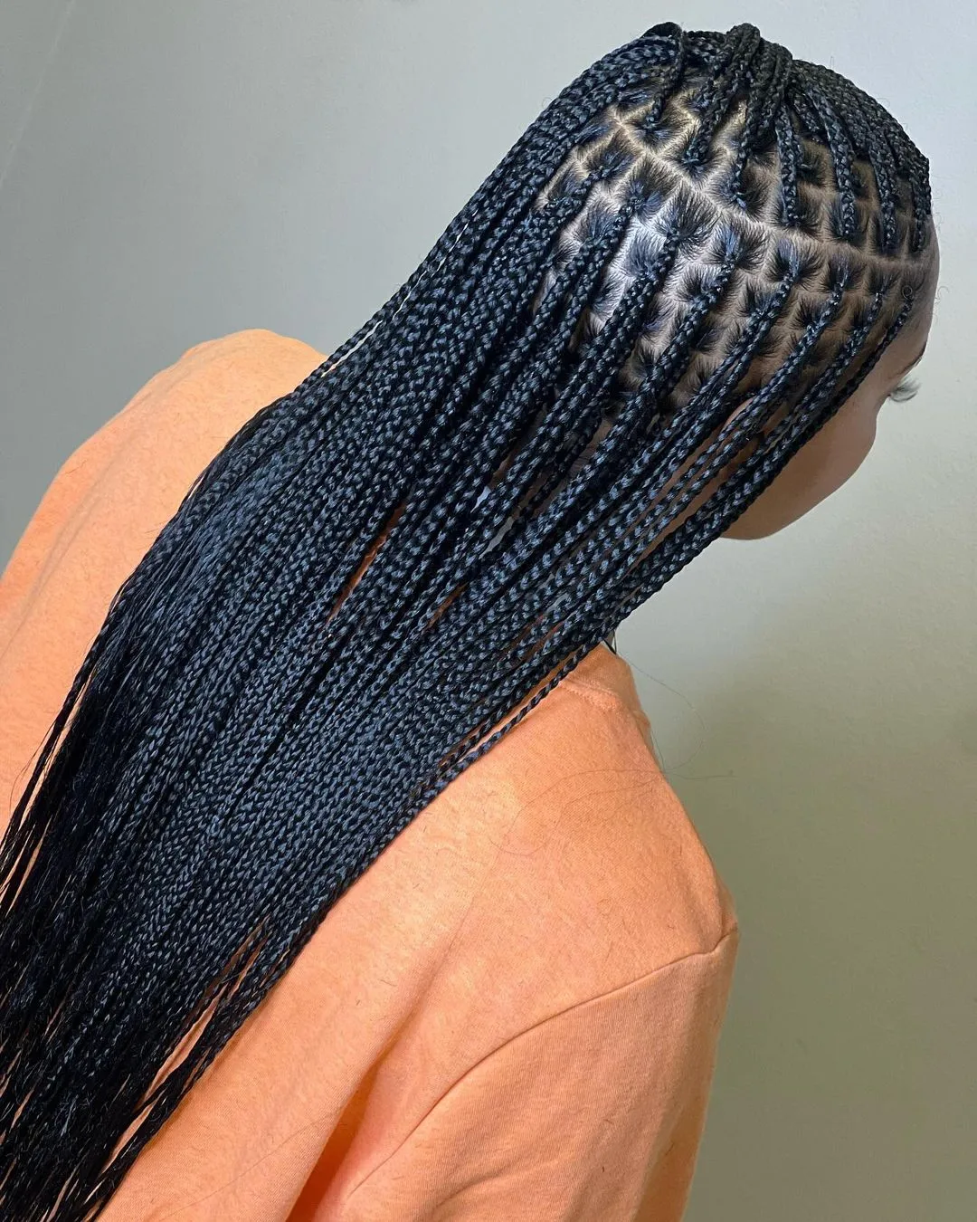 Sleek Mid-Back Box Braids With Defined Parts