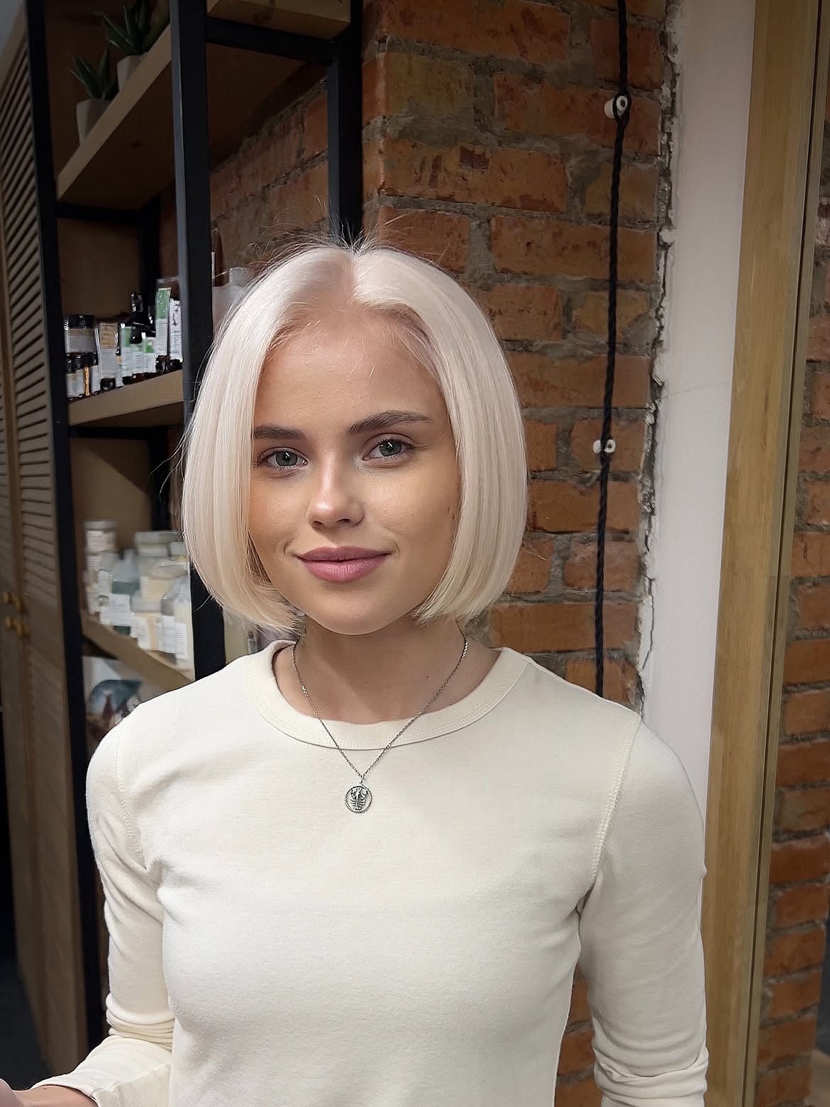 Sleek Platinum Blonde Bob With Inward Curve