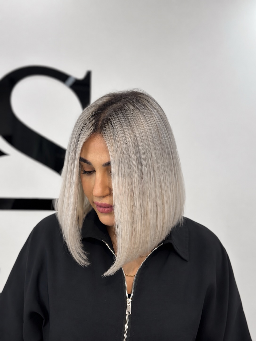 Sleek Platinum Blonde Bob With Smudged Shadow Root