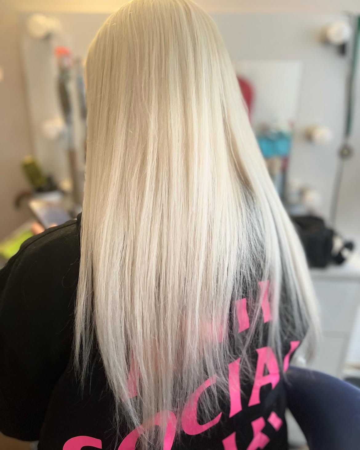 Sleek Platinum Blonde Hair With Subtle Pink Undertones