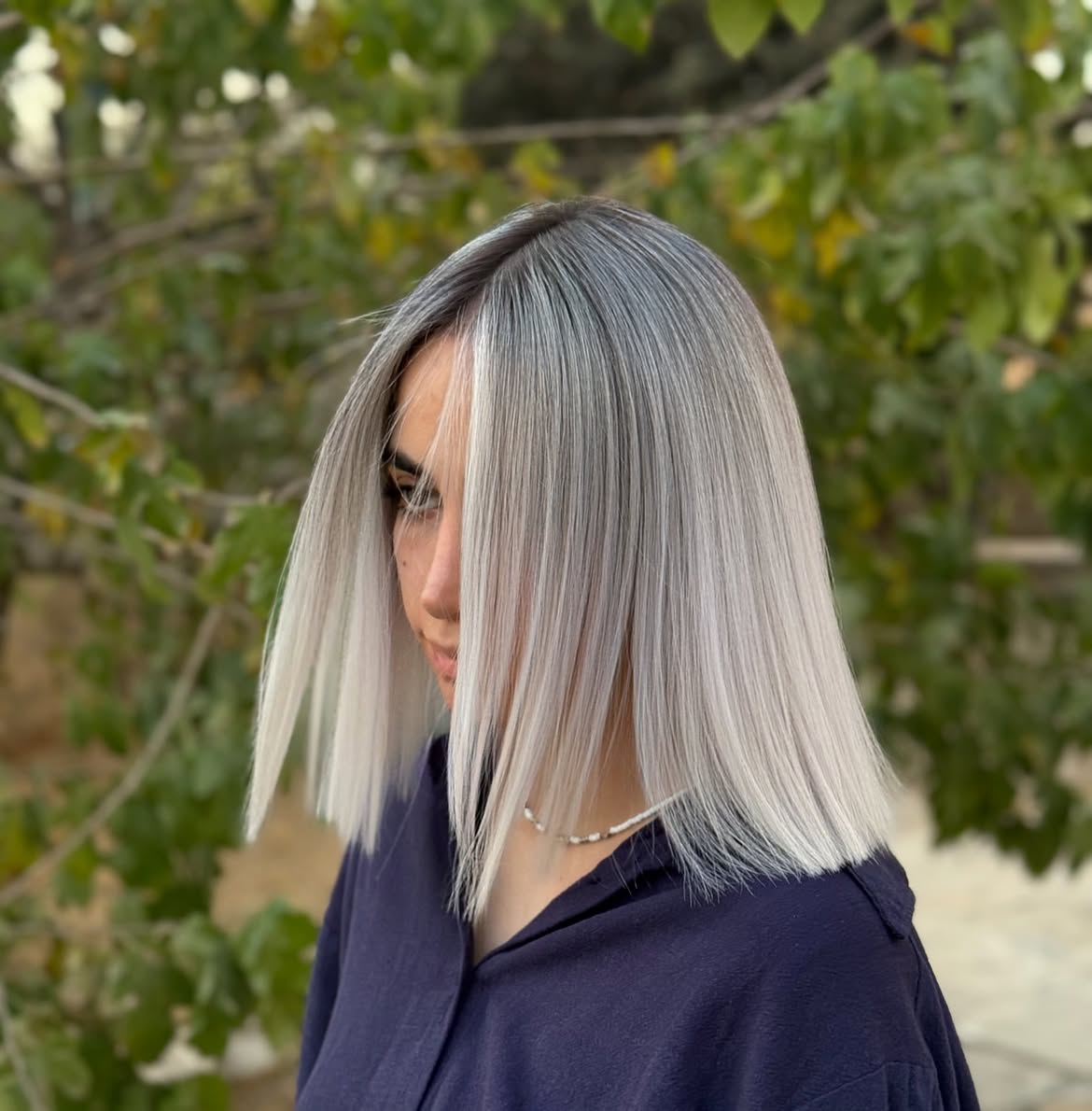 Sleek Platinum Blunt Lob With Dark Shadow Root