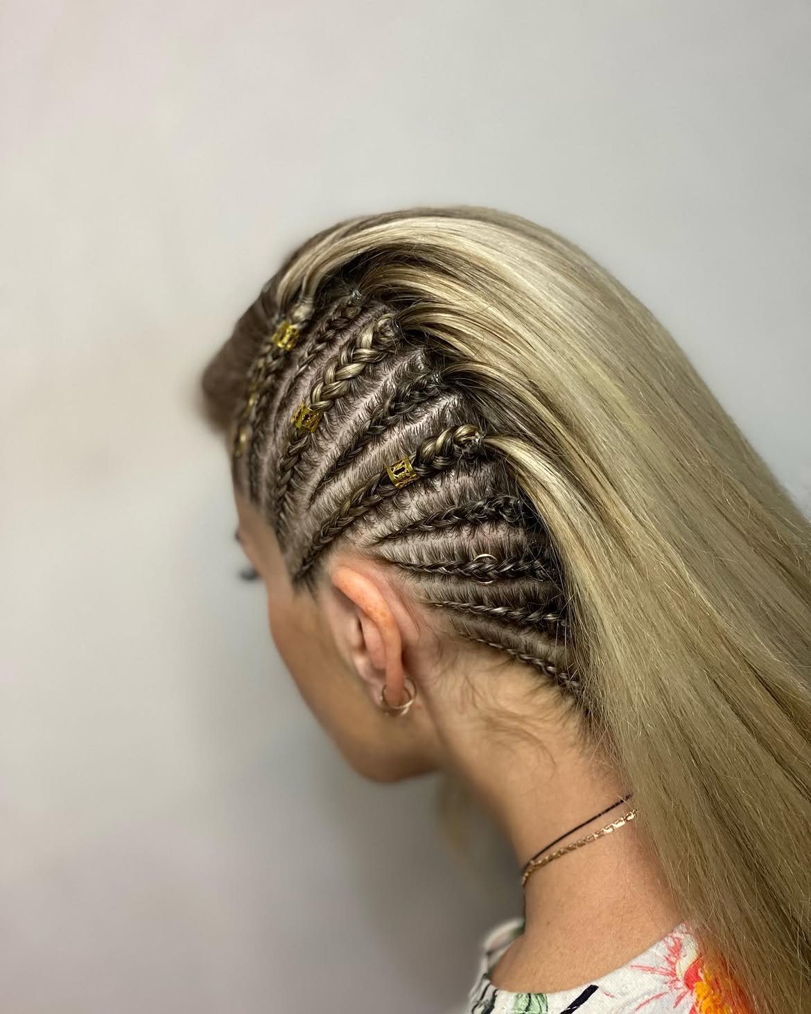 Sleek Side Braids With Gold Hair Rings