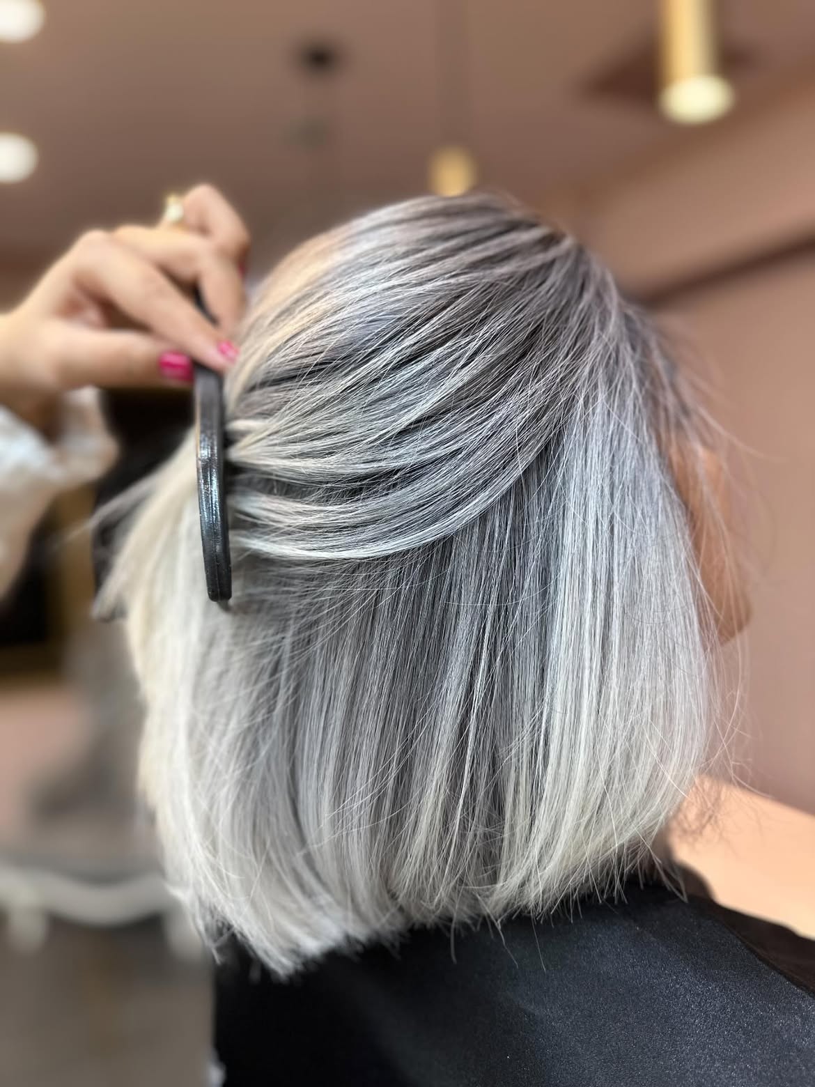 Sleek Silver Bob With Subtle Root Smudge