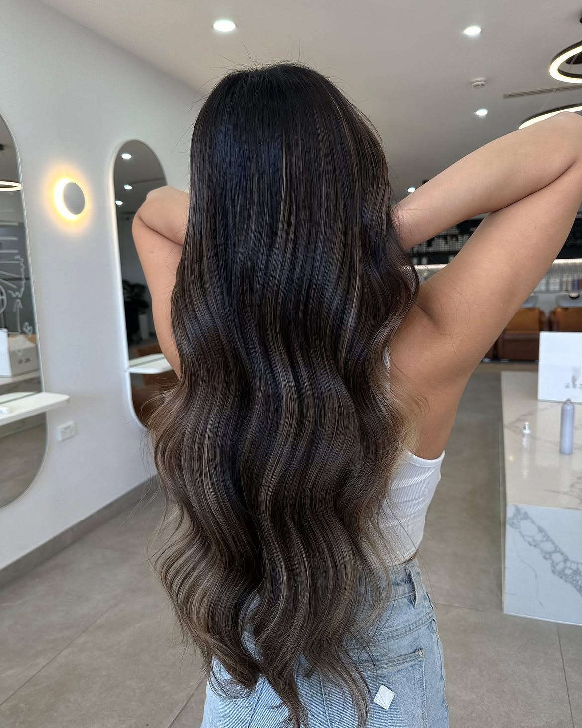 Smoky Ash Highlights On Dark Wavy Hair
