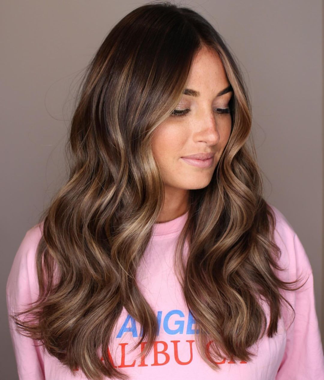 Soft Caramel Highlights On Brunette Waves