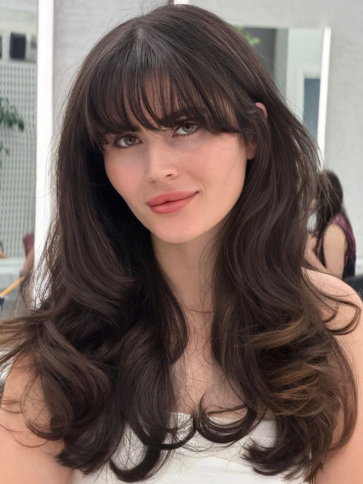 Soft Chocolate Brown Waves With Face-Framing Curtain Bangs