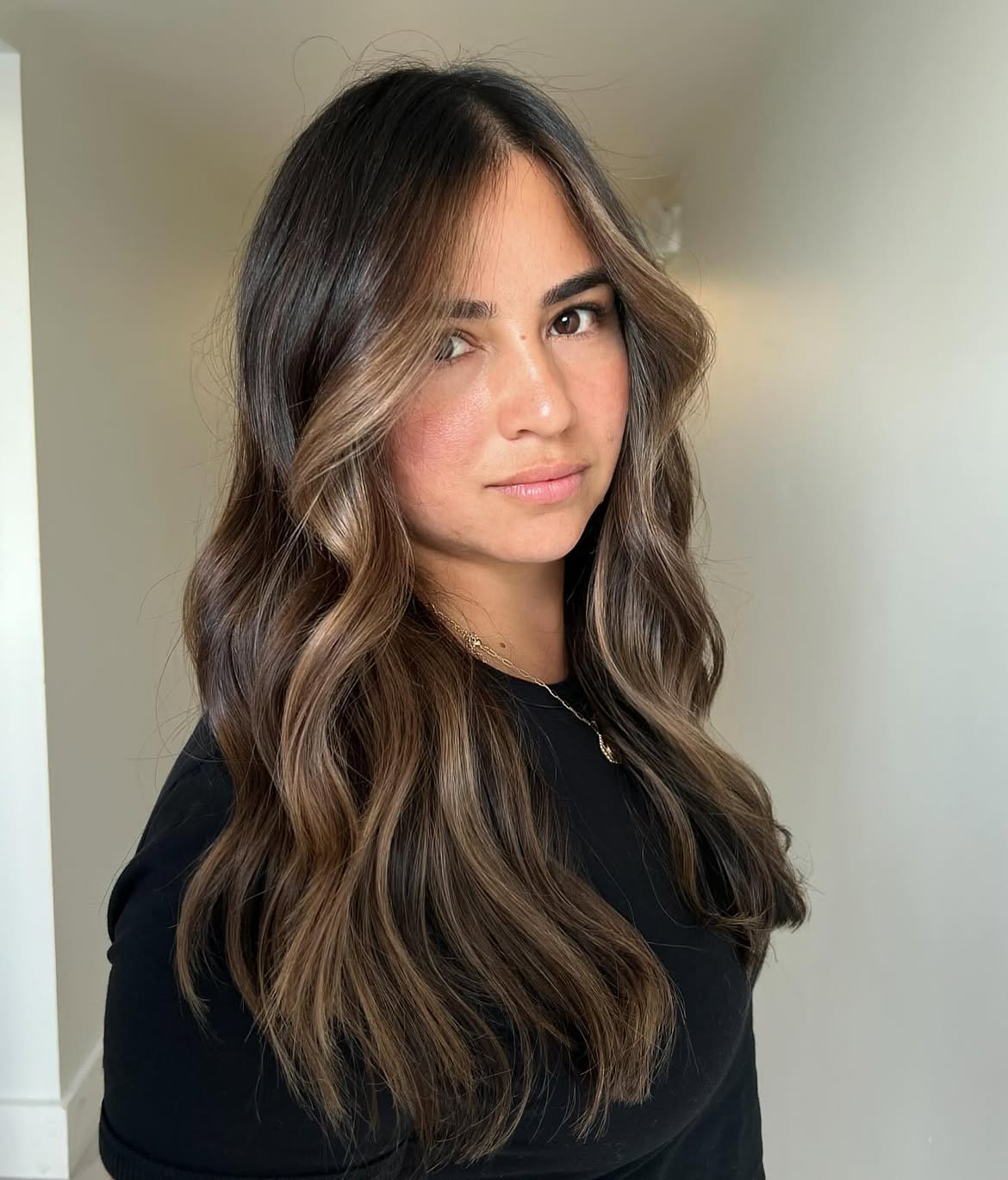 Soft Face Framing Highlights On Wavy Brunette Hair