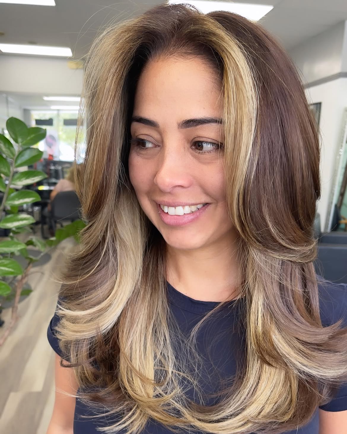 Soft Layered Brunette With Bright Money Piece