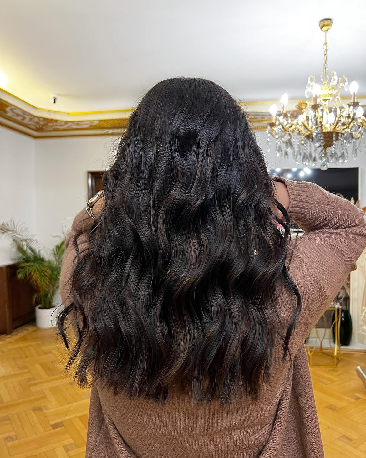 Soft Mocha Highlights On Long Wavy Black Hair