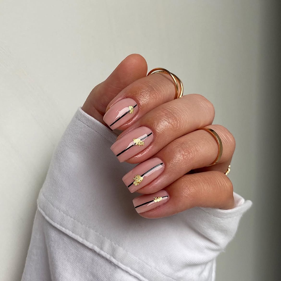 Soft Pink Nails with Black Stripe and Gold Foil