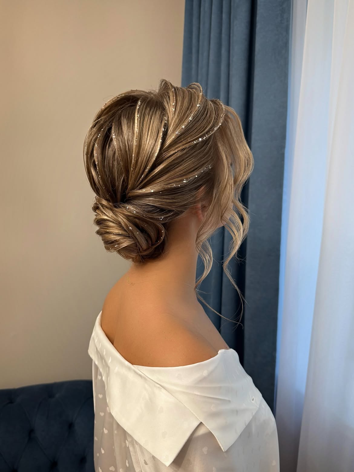 Sparkling Low Chignon With Soft Face-Framing Waves