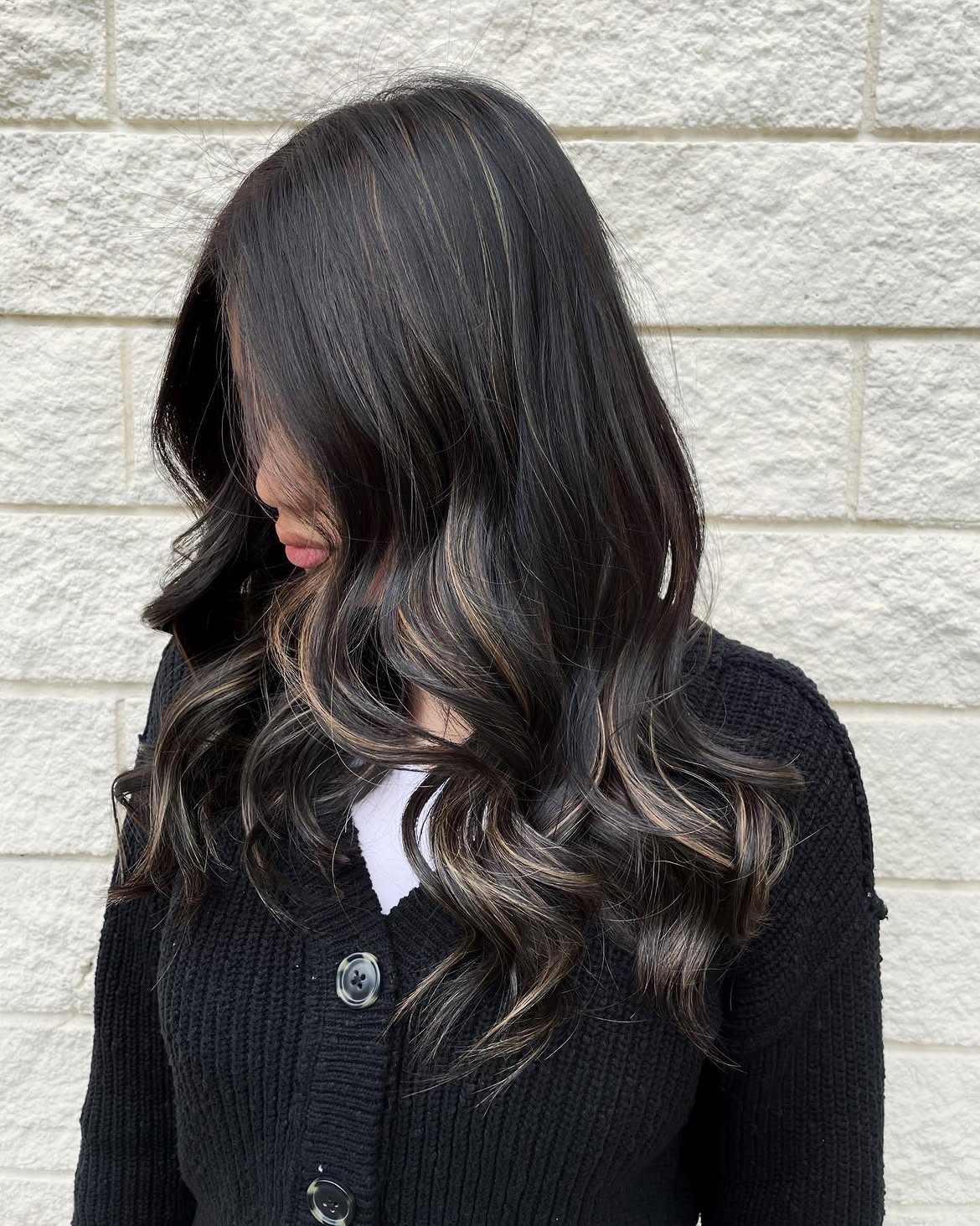 Subtle Caramel Highlights On Dark Wavy Layers
