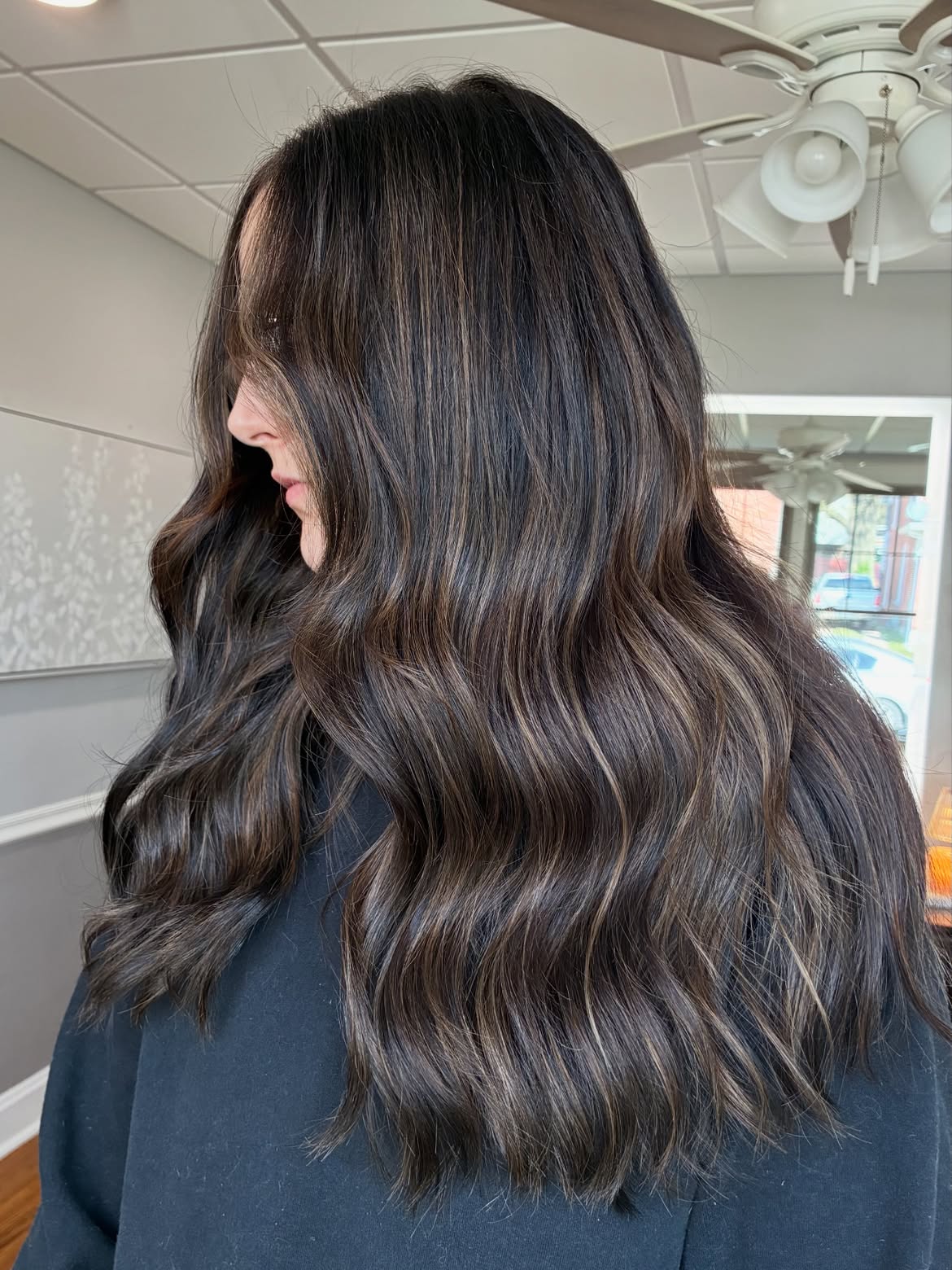 Subtle Caramel Highlights On Long Dark Waves