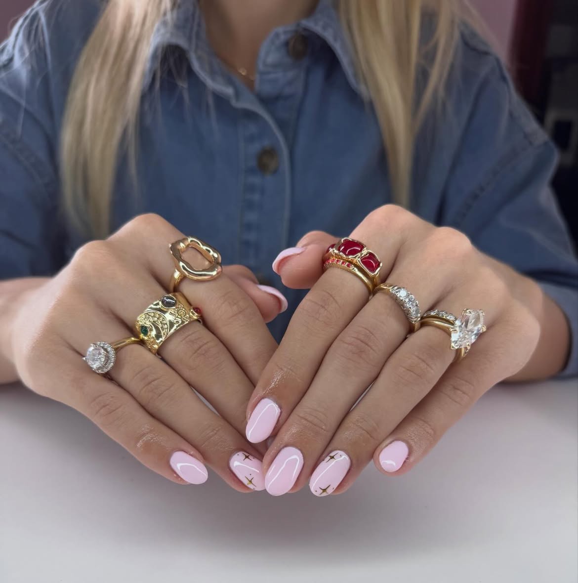 Sweet Pink Oval Nails with Gold Star Accents