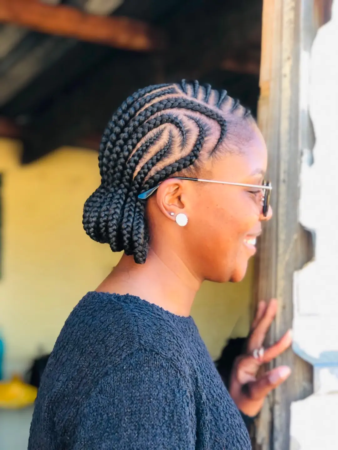 Swirl Pattern Cornrows With Low Braided Bun