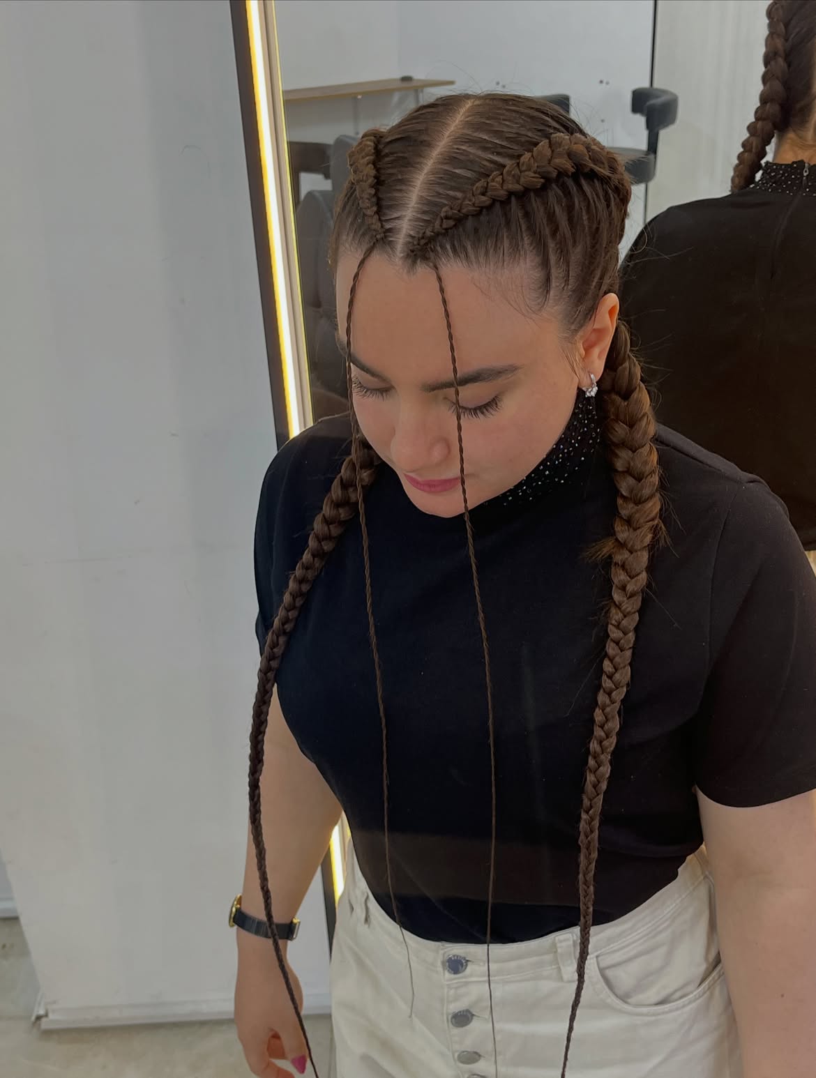 Tight Dutch Braids With Face Framing Tendrils