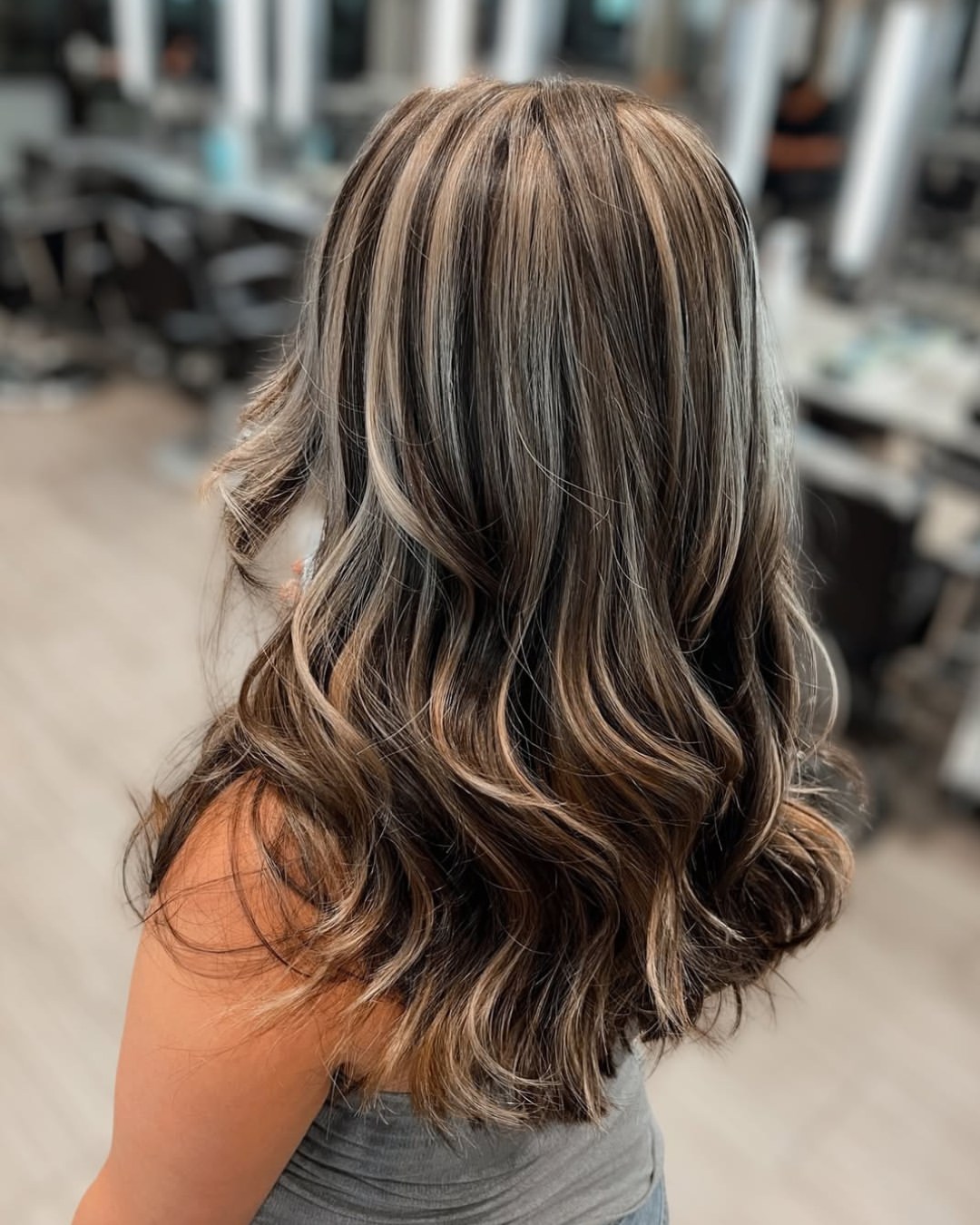 Tousled Honey Blonde Streaks On Wavy Bob
